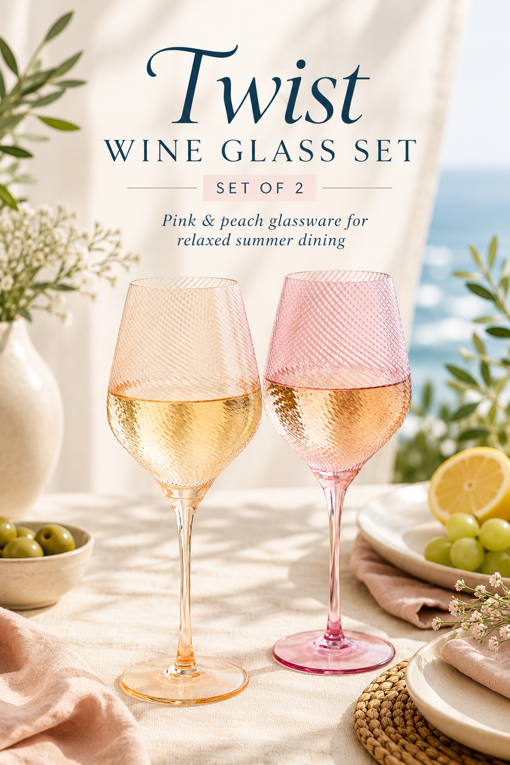 Two twist wine glasses in pink and peach hues on a table with outdoor setting