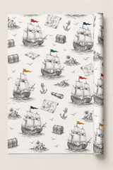 Vintage pirate ship gift wrap with monochrome sailing ship illustration and coloured flag details.