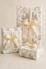 Vintage teddy bear gift wrap with birthday cake, balloons and picnic details on a white background.