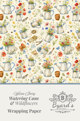 A wrapping paper design sheet featuring a repeating watercolor pattern of vintage blue watering cans filled with wildflowers on a cream background, with a lower text panel reading 'Warm Ivory Watering Cans & Wildflowers Wrapping Paper' and the Byard's Boutique logo.