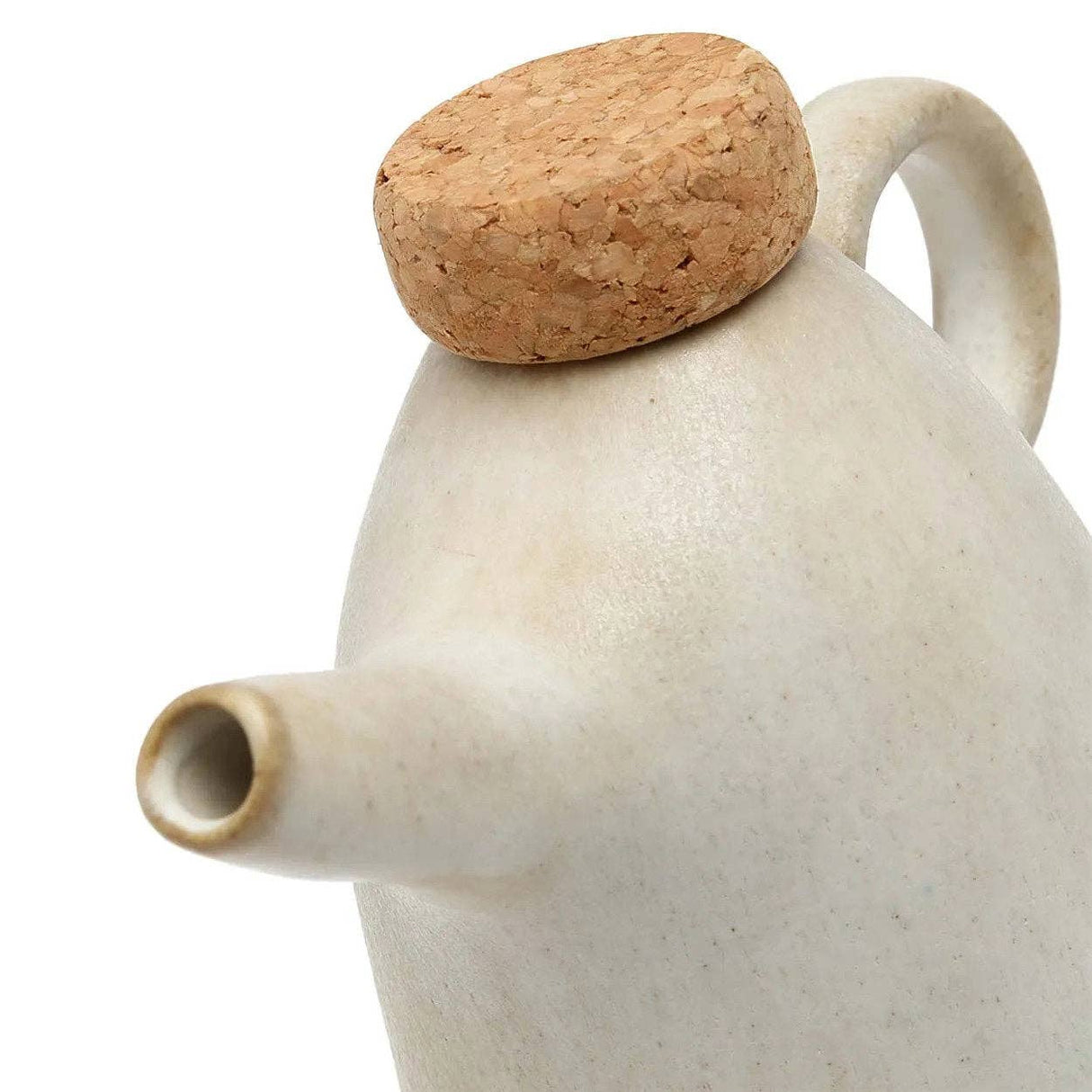 Ceramic teapot with a cork lid on a white background