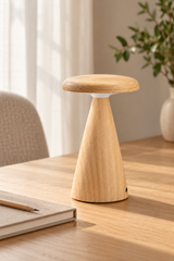 Compact LED table lamp in white ash wood and frosted acrylic. Features touch controls, warm white lighting, seven rotating RGB colours and a fixed-colour setting. Rechargeable via USB-C for cordless use. Suitable for ambient lighting on bedside tables, shelves and desks.