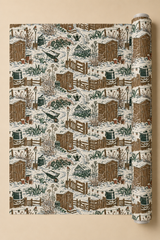Winter allotment Christmas wrapping paper showing snow-covered sheds, fences, cold frames, cabbages, wheelbarrows, garden tools and robins in deep green and brown.
