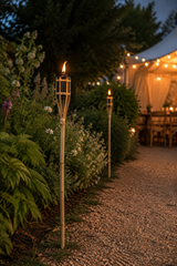 Yellow 60cm Bamboo Garden Fire Torch with Oil Chamber, lining a pathway to a wedding.