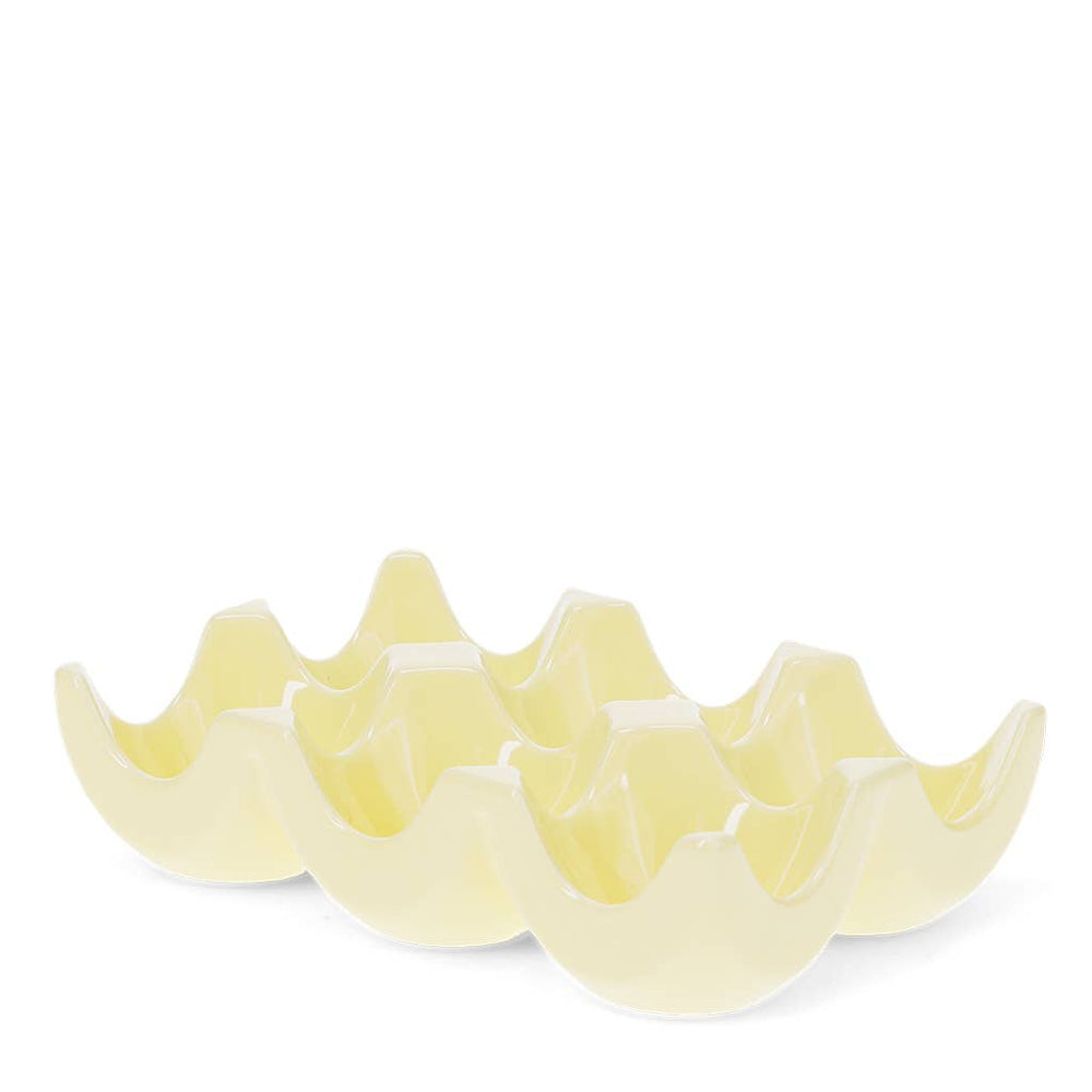 Yellow ceramic six egg holder on a white background