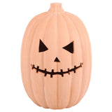 Decorative terracotta pumpkin with a jack-o'-lantern face on a white background