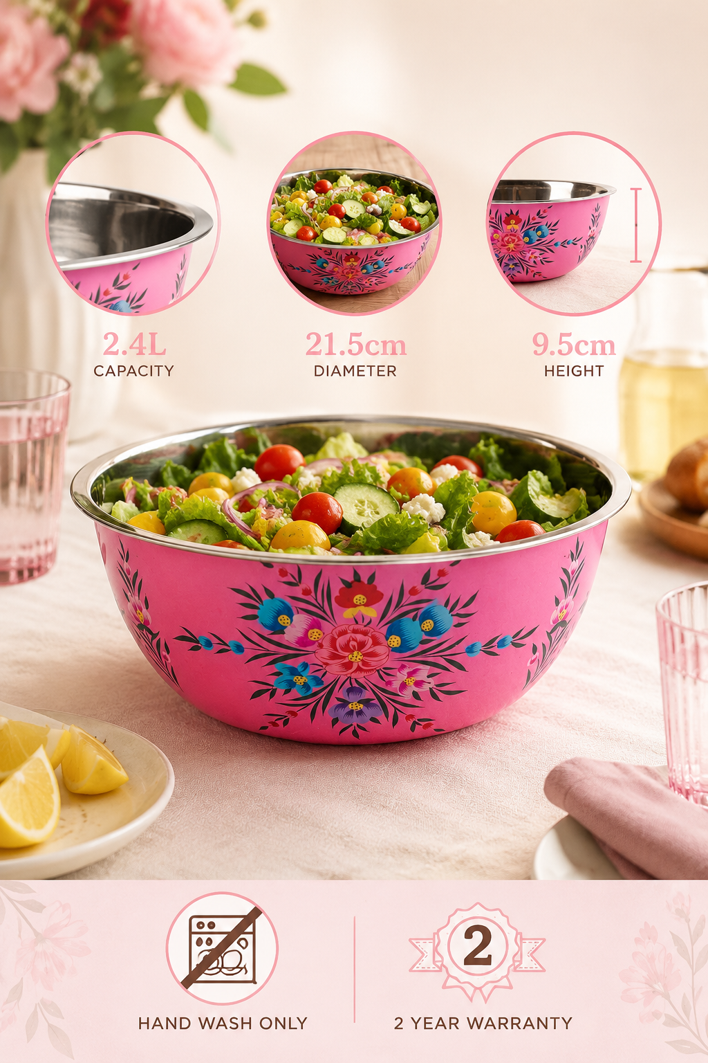 Pink floral-patterned salad bowl with salad and lemon slices on a table.