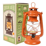 Orange hurricane lantern with packaging on a white background