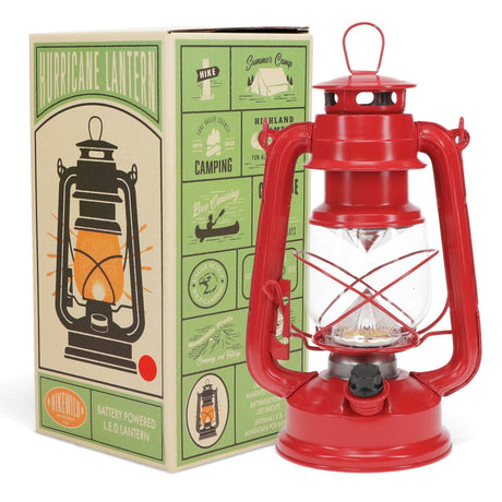 Red hurricane lantern with packaging in the background