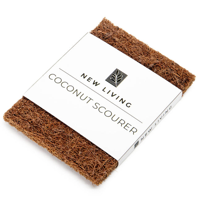 Coconut scourer with 'New Living' branding on a white background