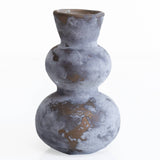 glass vase with a textured surface on a white background