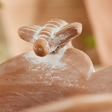 Close up of bee detail on terracotta bowl