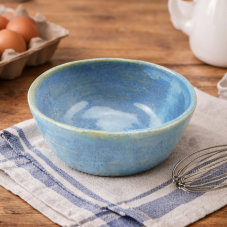 blue  bowl in various settings including a kitchen.