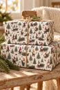 Two stacked Christmas gnome parcels with twine on a rustic pine bench.