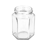 Clear hexagonal glass jar on a white background