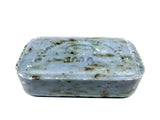 Rectangular stone object with engraved design on a white background