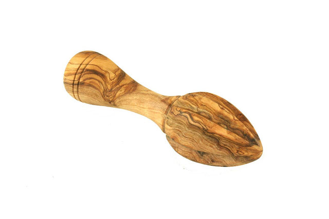 Wooden kitchen lemon squeezer tool with a handle on a white background