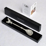 Decorative jam spoon with a chicken on top in a black box 