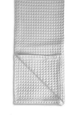 Waffle-textured blanket on a white background