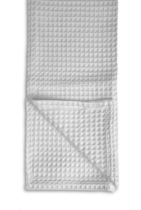 Waffle-textured blanket on a white background