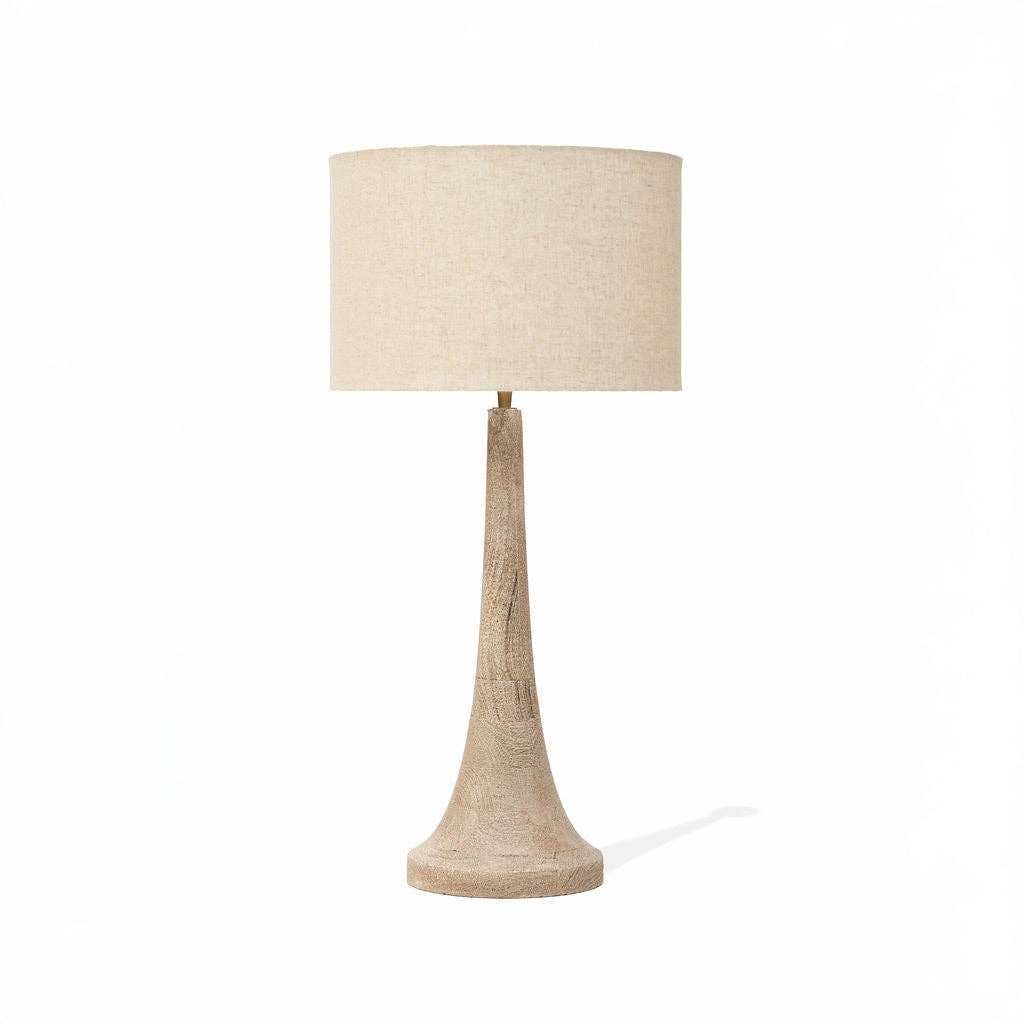 Table lamp with a beige lampshade and base on a white background
