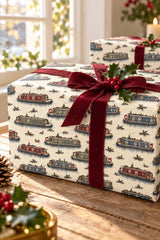 Close-up of a narrowboat Christmas gift wrapped with burgundy ribbon and holly.