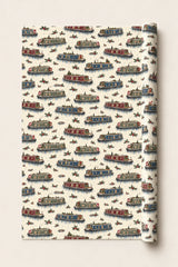Festive narrowboat Christmas wrapping paper roll with decorated red, green and blue canal boats on cream.