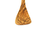 Wooden spoon with a textured handle on a white background