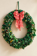 Close-up of patterned recycled fabric in a green sari wreath