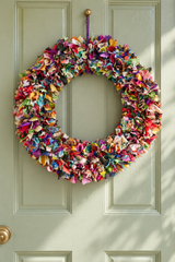 Multicolour recycled sari fabric wreath hanging on a door