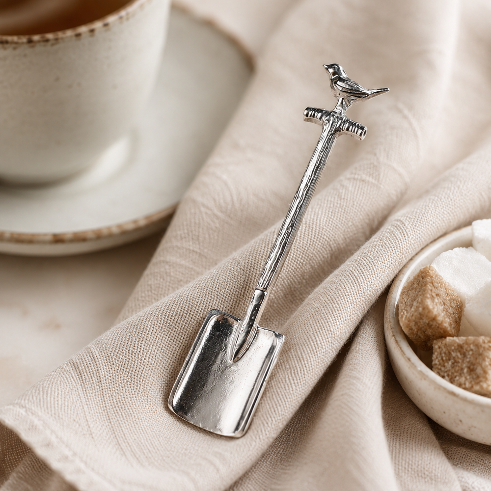 silver Sugar spoon spade with a robin on the handle.  