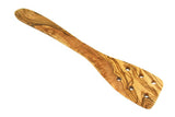 Wooden spatula with a wavy pattern on a white background