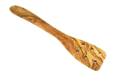 Wooden spatula with a wavy pattern on a white background