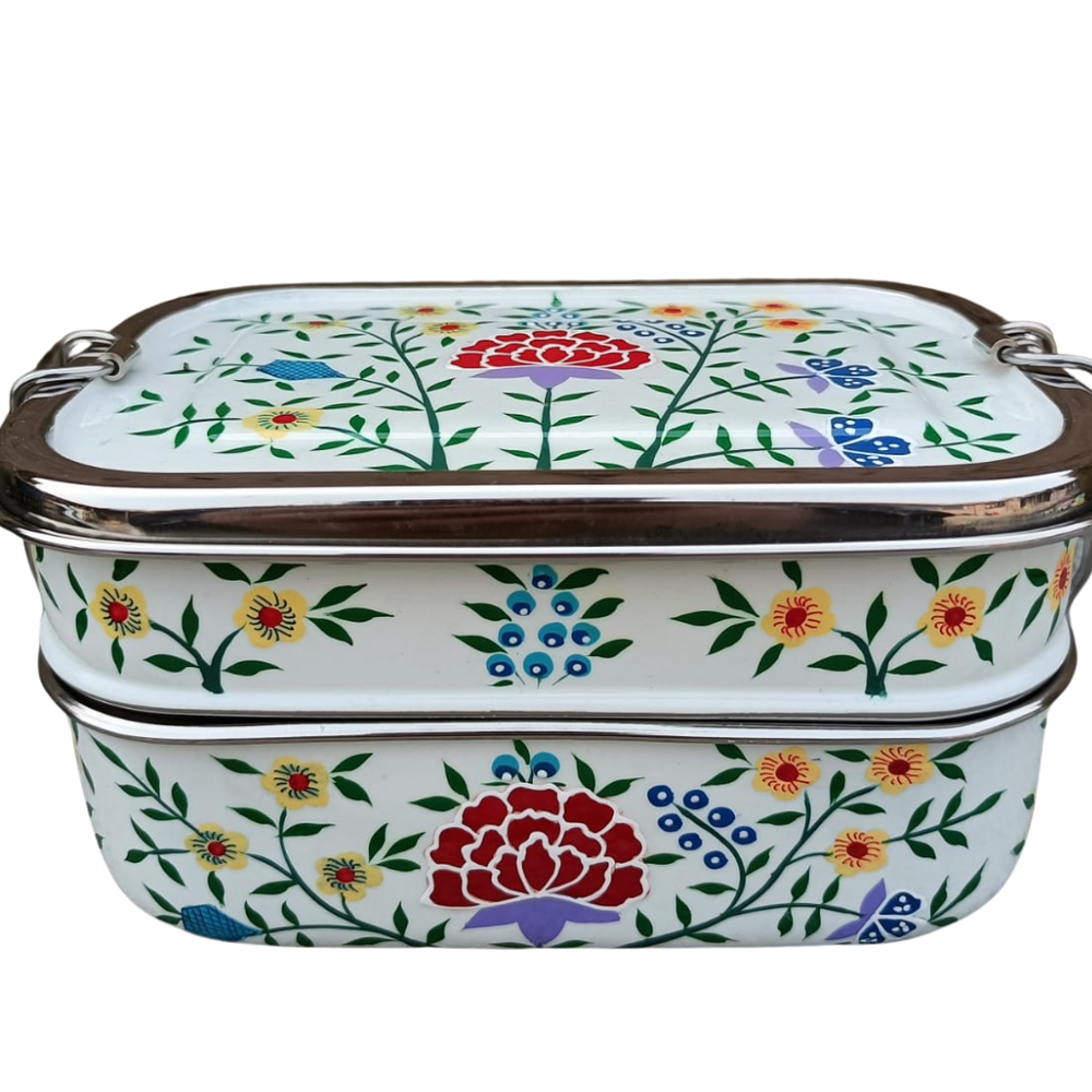 tiffin tin with floral patterns on a white background
