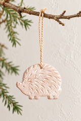 Terracotta hedgehog tree decoration on a twig display