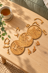Three Rings wooden puzzle with loose pieces on an oak coffee table beside a cup of tea and sage sofa.