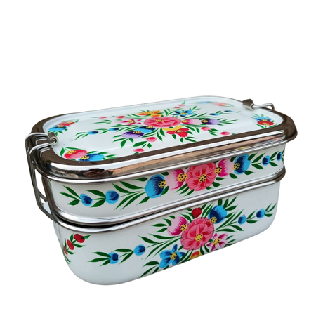 tiffin tin Stackable enamel containers with floral design on a white background