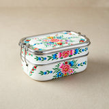 tiffin tin Stackable containers with floral design on a beige background
