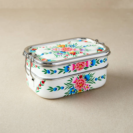 tiffin tin Stackable containers with floral design on a beige background