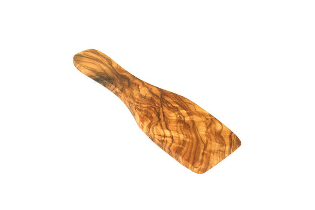 Wooden spoon with a wavy pattern on a white background
