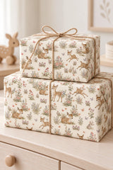 Two woodland animal gift parcels tied with twine on a pale nursery dresser.