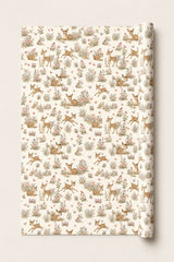 Woodland fawn wrapping paper roll with spotted deer, rabbits, butterflies and meadow flowers on a cream background.